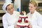 Confectioners or bakers presenting wedding cake