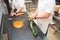 Confectioners making candies from melted sugar in candy workshop