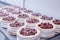 Confectionery production for the manufacture of sponge cakes with fresh cherry berries and cream, dessert, background