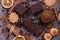 Confectionery products- chocolate wafers, cookies, coconut biscuits on a wooden table, top view.