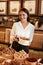 Confectionery. Woman Selling Chocolate Candies In Store