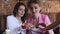 Confectionery. Women tasting chocolate candy in cafe