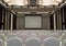 Conference Meeting Room with ceiling LED lights, Row of White Chairs, with Stage and Empty Screen for Business Meeting, Conference