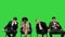 Conference participants looking tired and bored, yawning, fidgeting on their seats on a green screen, chroma key.