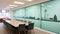 A conference room with a large glass wall, AI