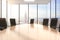 Conference wooden table and chairs in an office with a cityview