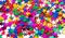 Confetti background of small colored stars