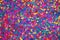 Confetti festive background. Texture of colored circles made of paper, closeup