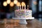 A confetti-like dots birthday cake with candles on top