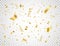 Confetti on transparent background. Falling shiny gold confetti. Bright golden festive tinsel. Party backdrop. Holiday