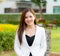 Confidence business woman standing in a park outdoor