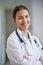 Confidence, face and doctor in hospital, clinic and wellness facility with smile and stethoscope in medical career