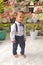 Confident adorable toddler boy in shirt with bowtie