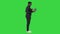 Confident African American businessman typing on laptop on a Green Screen, Chroma Key.