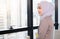 Confident Asia Muslim Islam businesswomen executive dressed in the religious veil, working in the modern office and standing in