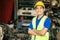 Confident Asian male engineer worker standing arm crossed happy smile for enjoy working in factory