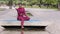 Confident athletic millennial african girl in sportswear relaxing on yoga mat after workout. Attractive young adult