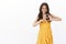 Confident attractive girlfriend fight for her love, stand yellow summer dress show heart sign and smiling motivated