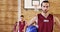 Confident basketball player holding a basketball