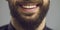 Confident bearded man white toothy smile close up studio face portrait