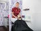 Confident Beautician Washing Male Customer\'s Hair