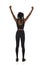 Confident black woman in sports clothes is standing with arms raised and cheering. Full length, rear view