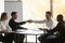 Confident boss handshaking company corporate client starting negotiations