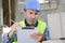 confident builder handyman examining construction works