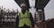 Confident builder walking on construction site