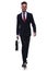 Confident businessman with suitcase in hand stepping