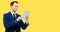 Confident businessman, yellow color background, Business success, copy space