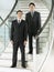 Confident Businessmen Standing On Stairs