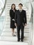 Confident Businesspeople Standing On Staircase