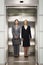 Confident Businesswomen Standing Together In Elevator