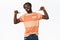 Confident, cheeky young musculine bearded african-american guy in striped t-shirt looking manly proudly pointing himself