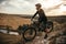 Confident cyclist admiring highlands in countryside