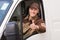 Confident Delivery Man Gesturing Thumbs Up In Truck