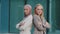 Confident diverse millennial colleagues Indian girl in hijab and young Caucasian woman wearing business suits standing