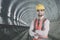 Confident engineer in the underground tunnel