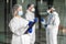 Confident expert virologist doc center clinic holding blank wear face mask hazmat blue uniform suit plastic facial goggles in