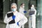 Confident expert virologist doc center clinic holding blank wear face mask hazmat blue uniform suit plastic facial goggles in