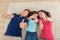 Confident family gesturing thumbs up at home