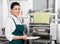 Confident Female Chef Holding Ravioli Pasta Tray