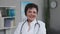 Confident female doctor close up portrait, friendly happy woman physician or nurse professional general practitioner