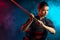 Confident female kendo warrior with shinai