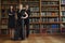 Confident Female Lawyers In Library