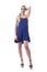 Confident feminine blond fashion girl in blue dress or nightie posing and holding long hair in tail