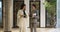 Confident friendly businesswomen talking in office hall