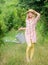 Confident gardener. small girl with watering can. earth day. environment ecology. nature protection. small girl farmer