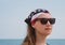 Confident girl in sunglasses american flag bandana. USA Independence Day patriotism concept, Memorial Day national pride